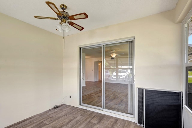 interior space with ceiling fan