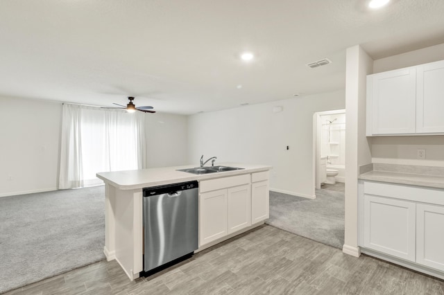 kitchen with light colored carpet, ceiling fan, sink, dishwasher, and white cabinetry