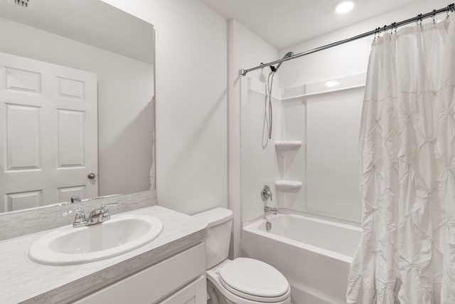 full bathroom with vanity, shower / bathtub combination with curtain, and toilet