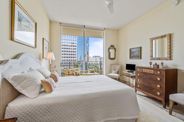 carpeted bedroom featuring floor to ceiling windows, access to outside, and ceiling fan