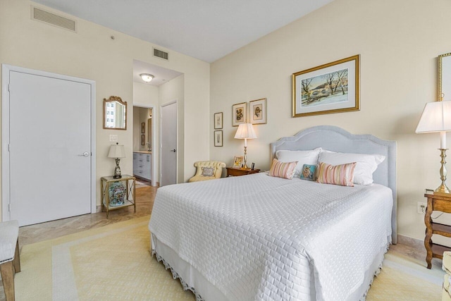 carpeted bedroom with ensuite bathroom