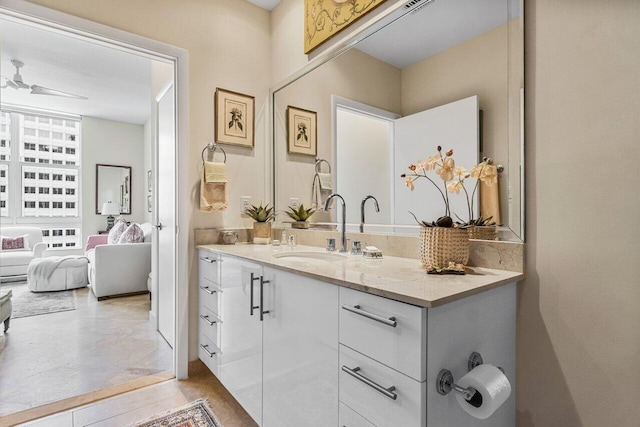 bathroom featuring tile patterned flooring, vanity, and ceiling fan