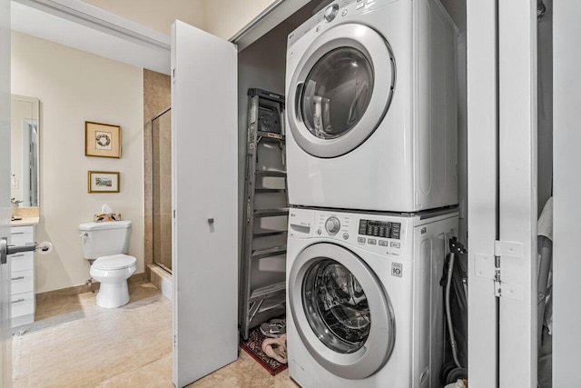 washroom with stacked washer / drying machine