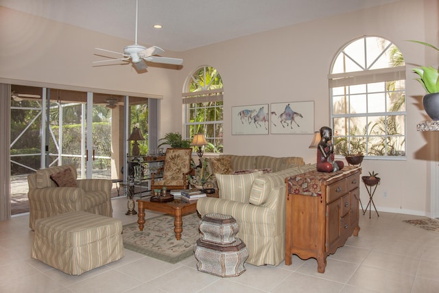 tiled living room featuring ceiling fan and plenty of natural light