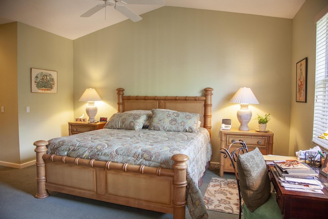 carpeted bedroom with ceiling fan and vaulted ceiling