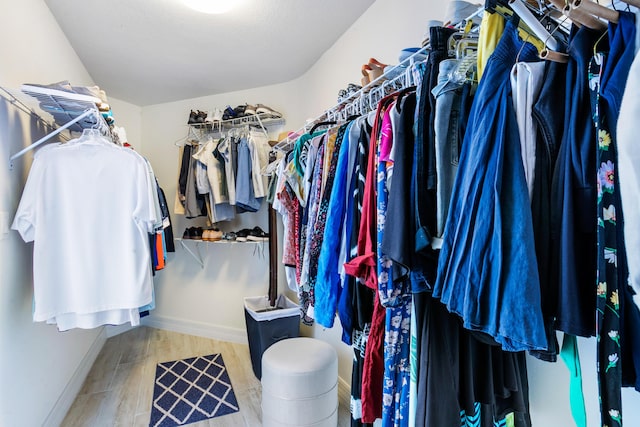 spacious closet featuring light hardwood / wood-style flooring