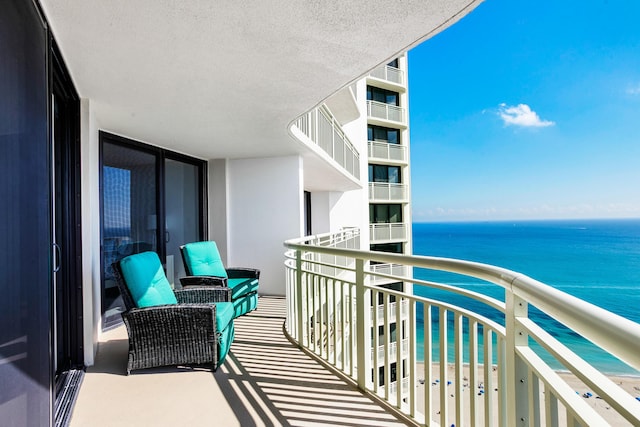 balcony featuring a water view