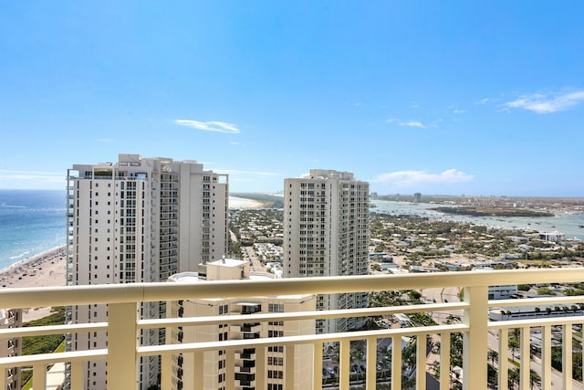 exterior space with a water view and a view of the beach