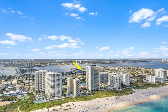 bird's eye view featuring a view of the beach and a water view