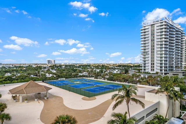 view of swimming pool featuring tennis court