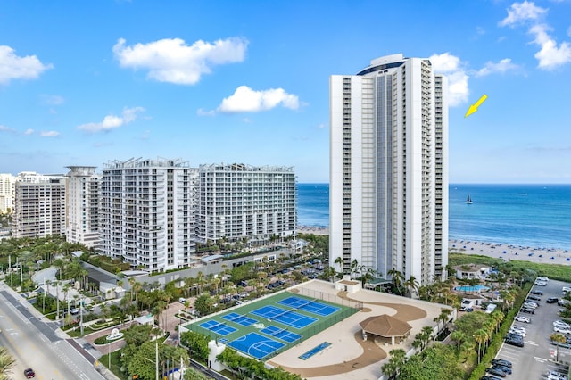 bird's eye view featuring a water view and a view of the beach