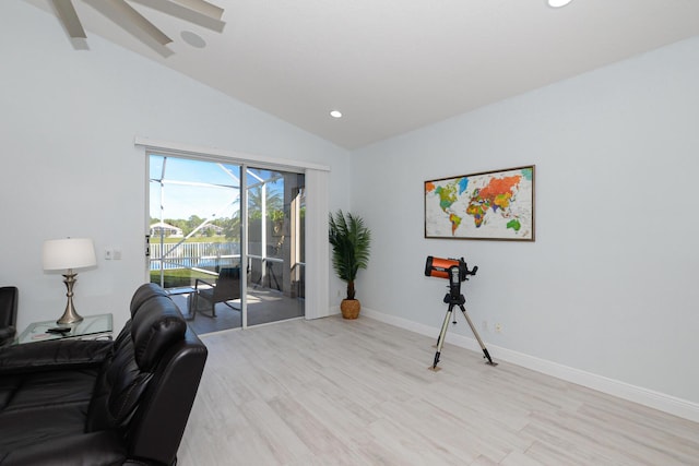 sitting room featuring light hardwood / wood-style floors and lofted ceiling