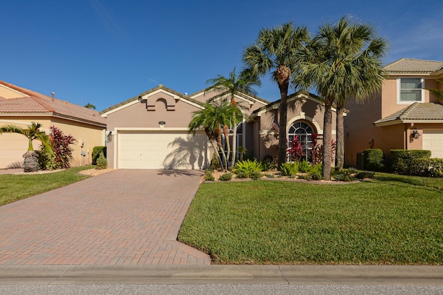 mediterranean / spanish house with a front lawn