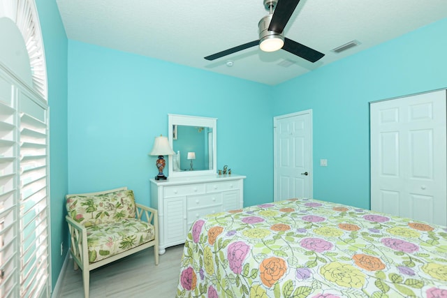 bedroom with ceiling fan and light hardwood / wood-style flooring