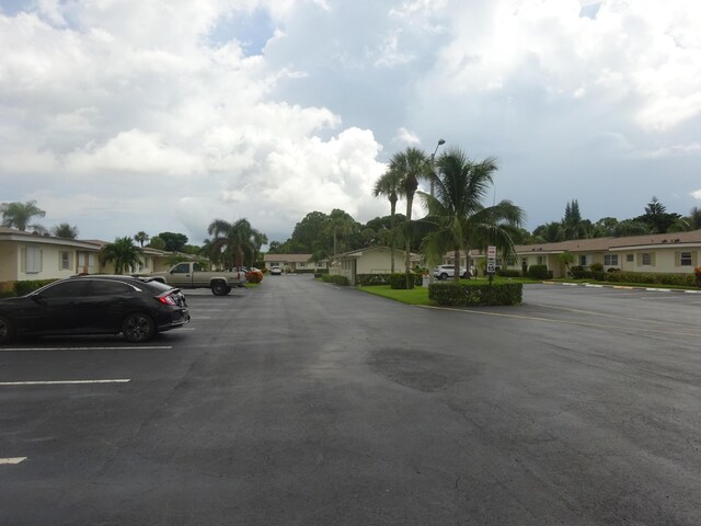 2864 Crosley Dr E Unit A, West Palm Beach, FL 33415 - uncovered parking lot with a residential view