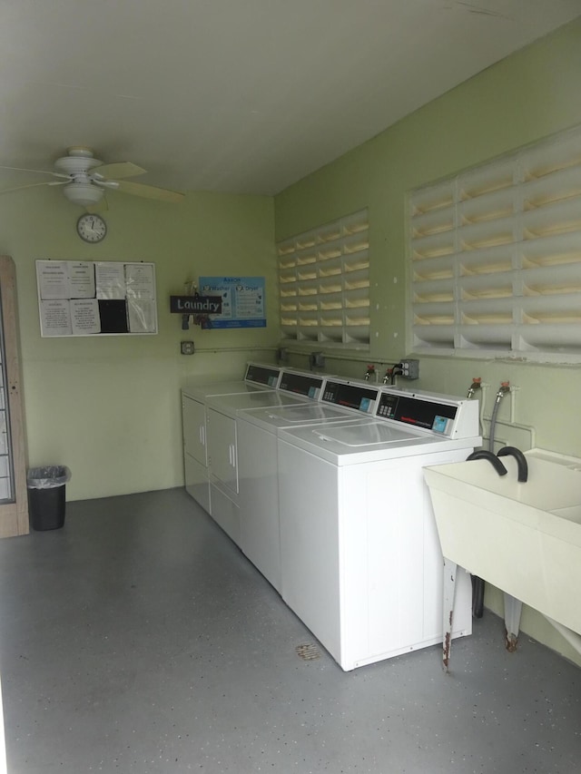 washroom featuring washer and dryer, ceiling fan, and sink