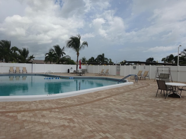 2864 Crosley Dr E Unit A, West Palm Beach, FL 33415 - community pool with fence and a patio area