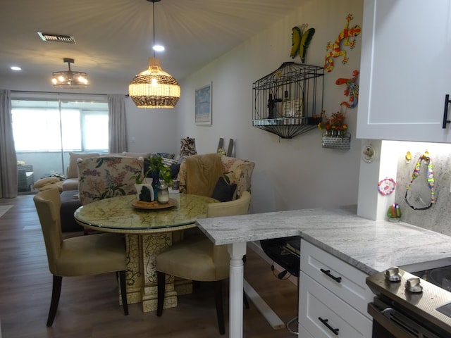 dining space featuring dark hardwood / wood-style flooring