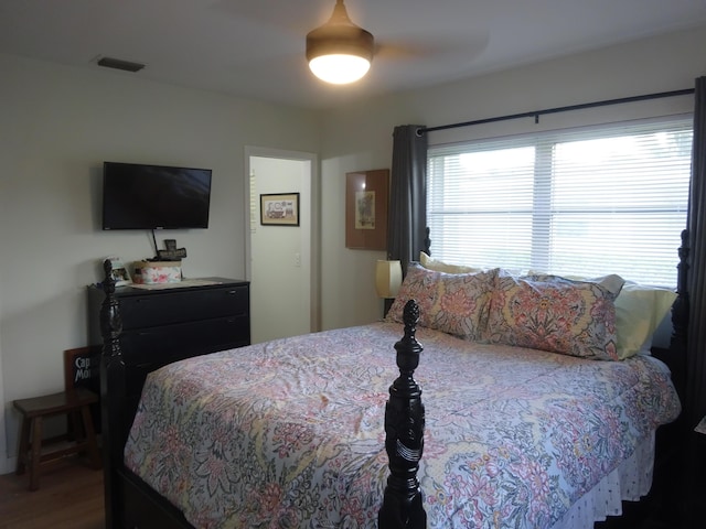 2864 Crosley Dr E Unit A, West Palm Beach, FL 33415 - bedroom featuring visible vents, ceiling fan, and wood finished floors