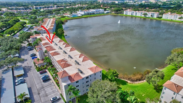 drone / aerial view with a water view