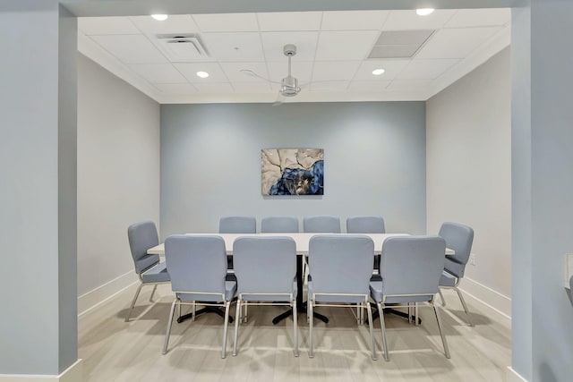 dining area featuring a paneled ceiling