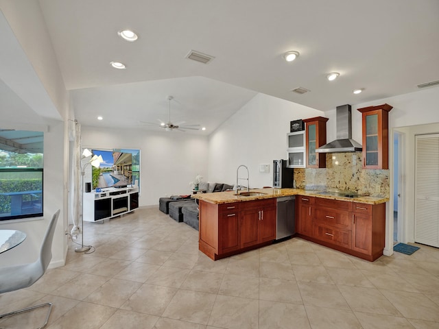 kitchen with ceiling fan, dishwasher, wall chimney exhaust hood, sink, and kitchen peninsula