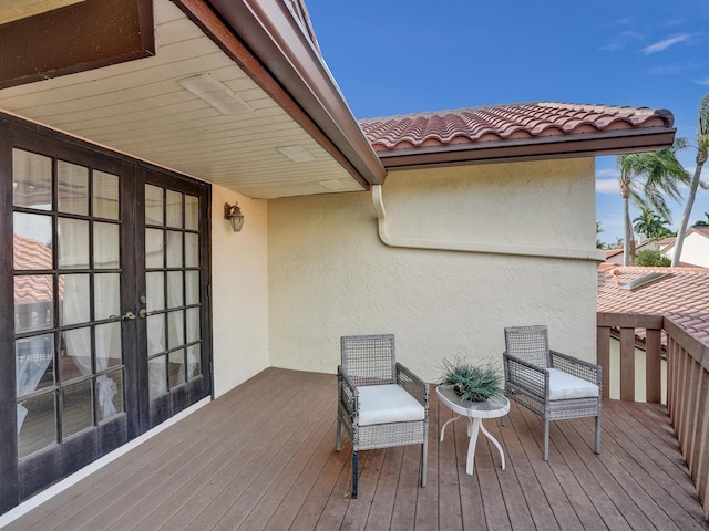 wooden terrace featuring french doors