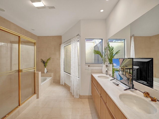 bathroom featuring separate shower and tub, tile patterned flooring, and vanity