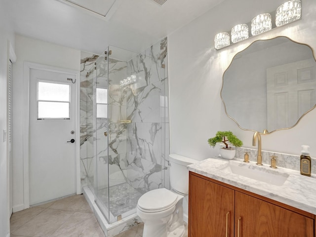 bathroom with vanity, a shower with shower door, and toilet