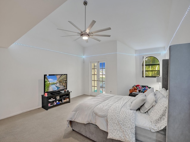 carpeted bedroom with ceiling fan, lofted ceiling, and french doors