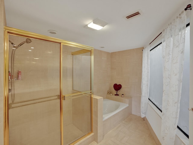 bathroom with independent shower and bath