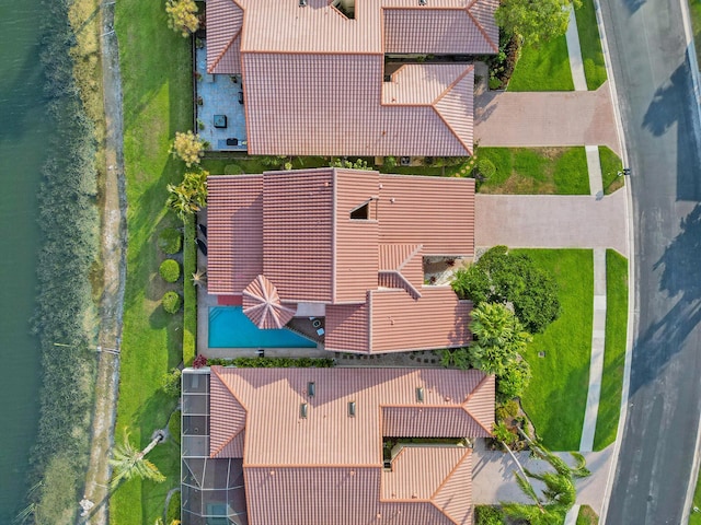 birds eye view of property with a water view