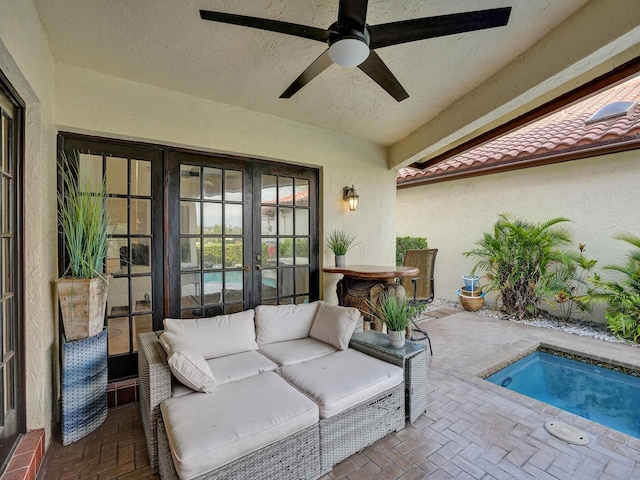 view of pool with ceiling fan, french doors, and a patio