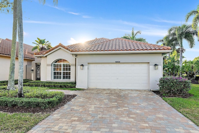 mediterranean / spanish house featuring a garage