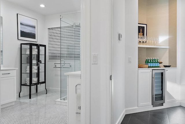 bathroom with tile patterned floors and wine cooler