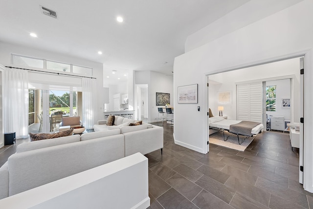 living room with a high ceiling