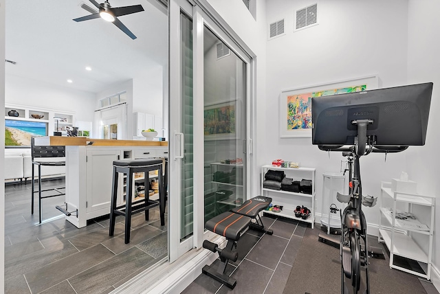 workout room with ceiling fan