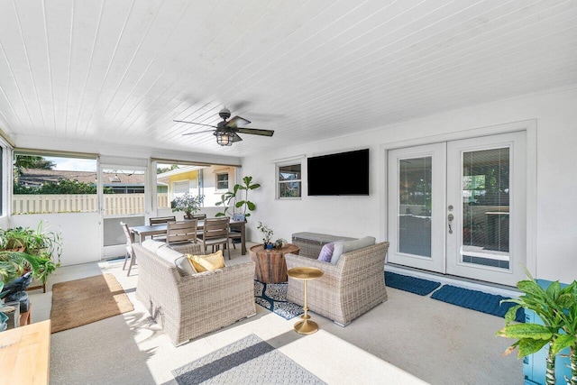 view of patio / terrace with ceiling fan, fence, outdoor dining area, french doors, and outdoor lounge area