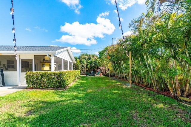 view of yard with a sunroom