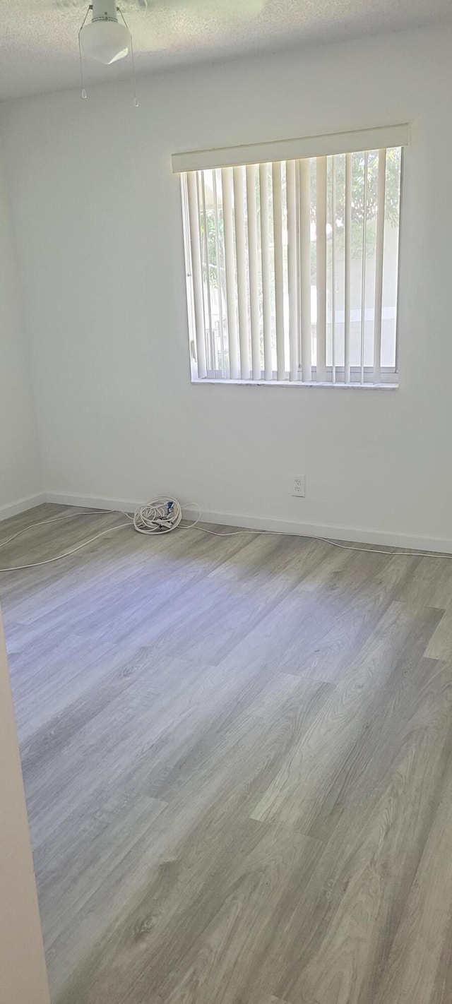 unfurnished room featuring plenty of natural light