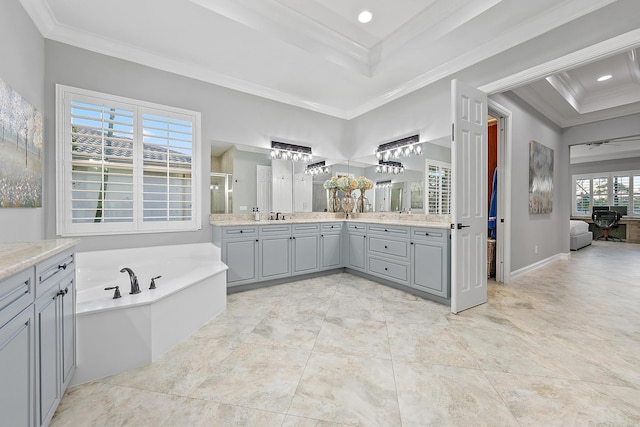 bathroom featuring separate shower and tub, crown molding, a raised ceiling, and vanity