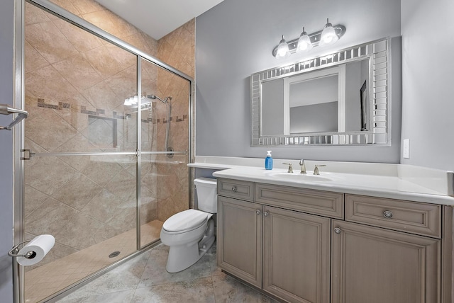 bathroom with toilet, vanity, tile patterned floors, and walk in shower