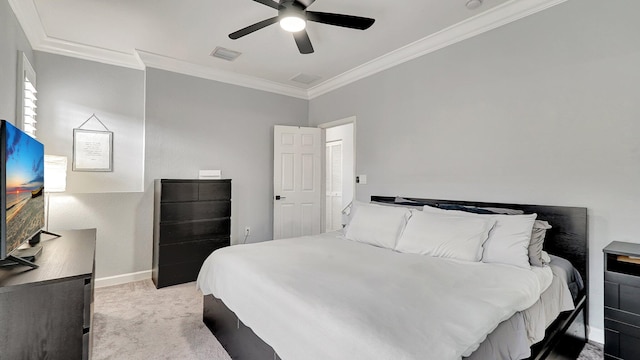 carpeted bedroom with ceiling fan and crown molding