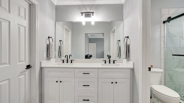 bathroom with vanity, toilet, walk in shower, and crown molding