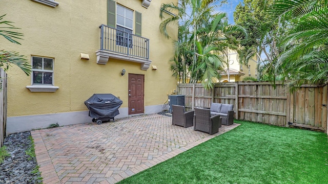 view of patio featuring grilling area, a balcony, cooling unit, and an outdoor hangout area