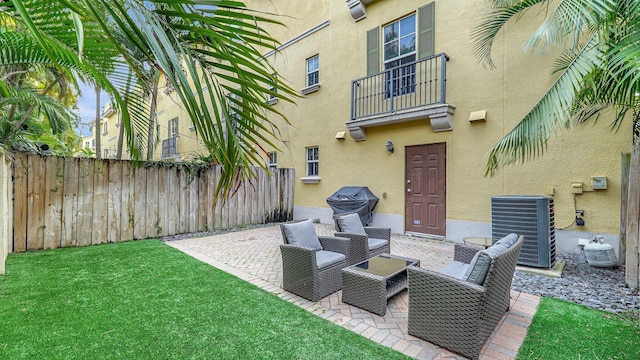 view of patio / terrace featuring a balcony and central AC unit