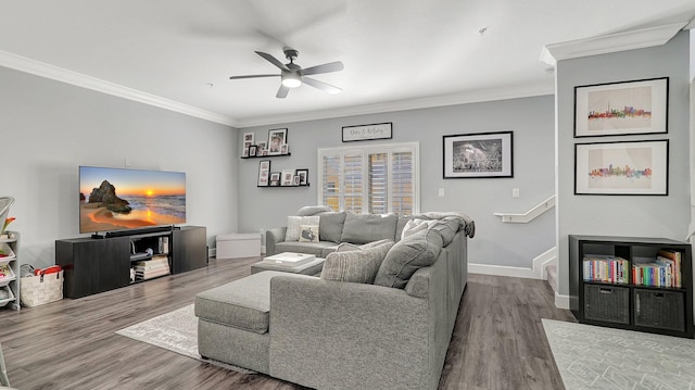 living room with hardwood / wood-style floors, ceiling fan, and ornamental molding