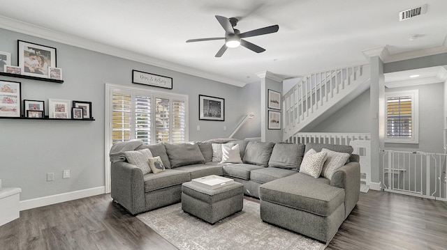 living room with hardwood / wood-style flooring, ceiling fan, and ornamental molding