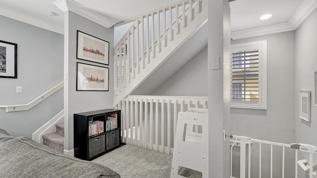 staircase featuring crown molding