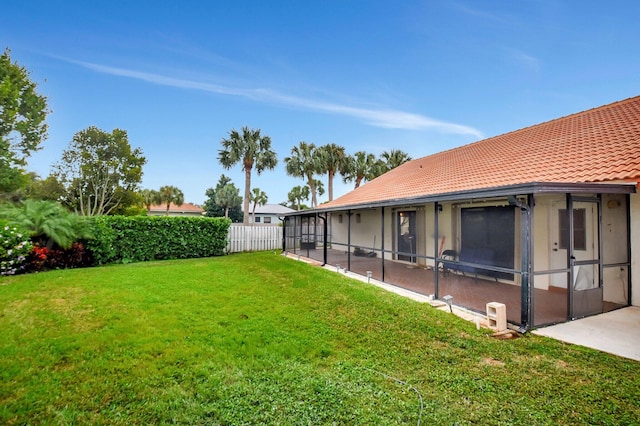 view of yard featuring a sunroom